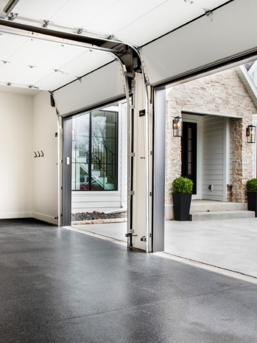 Garage with striking epoxy floor.